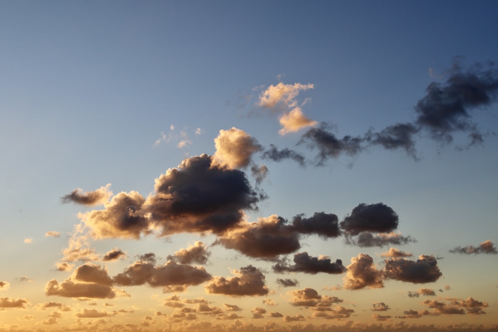 a group of clouds that are in the sky