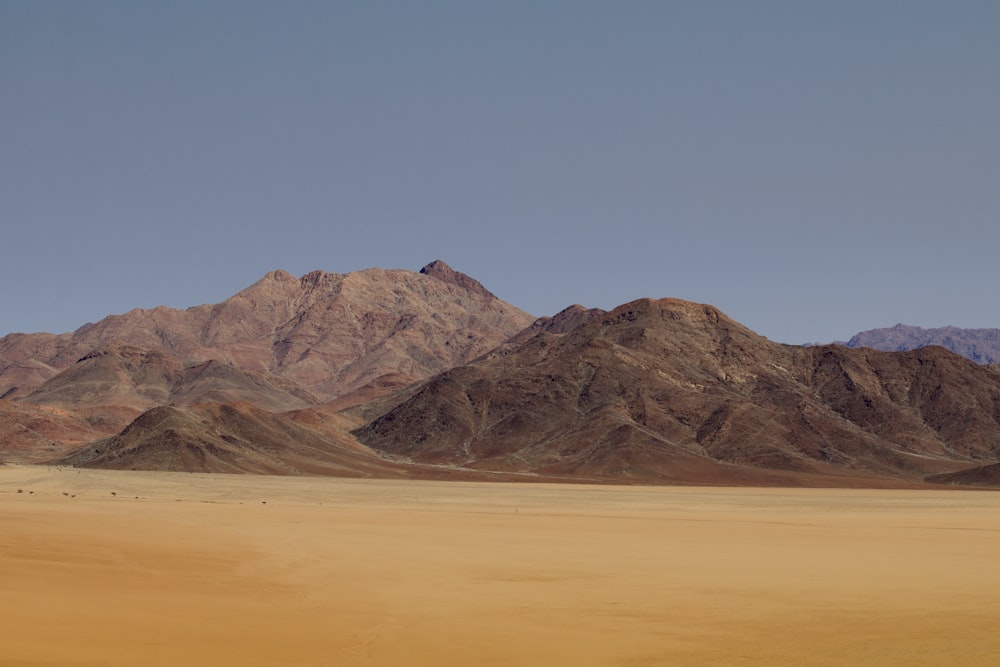 a mountain range in the middle of a desert