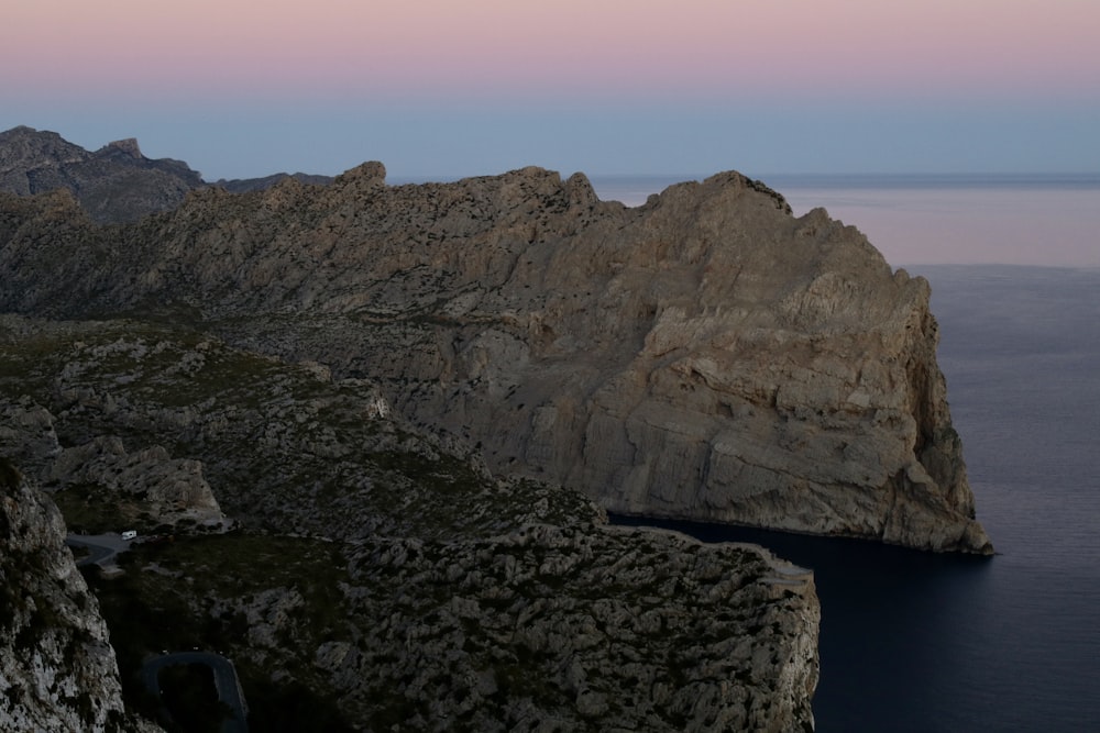 a mountain with a body of water in the middle of it