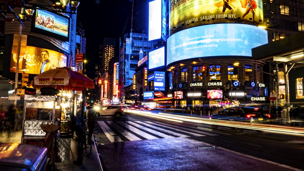 a busy city street at night with a lot of traffic