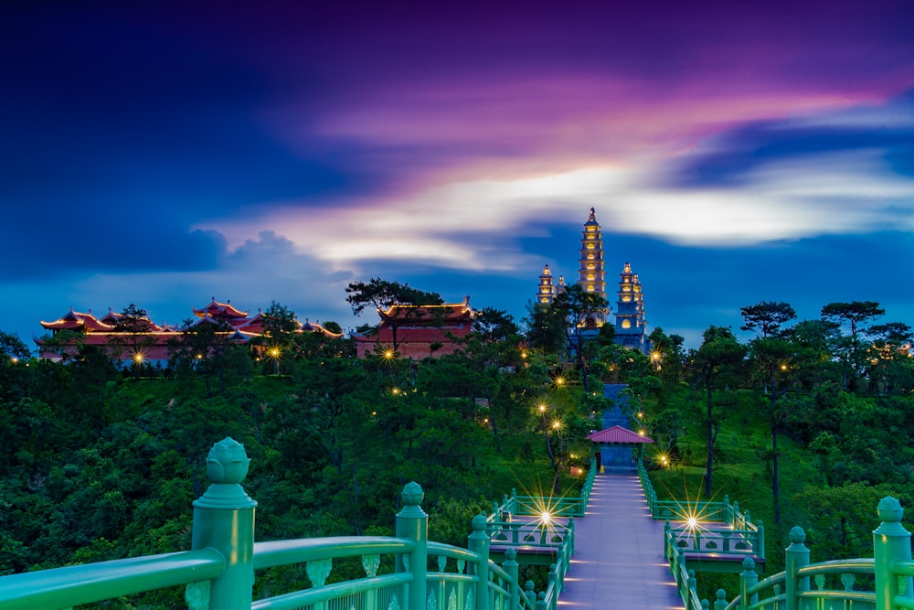 a view of a city at night from a bridge