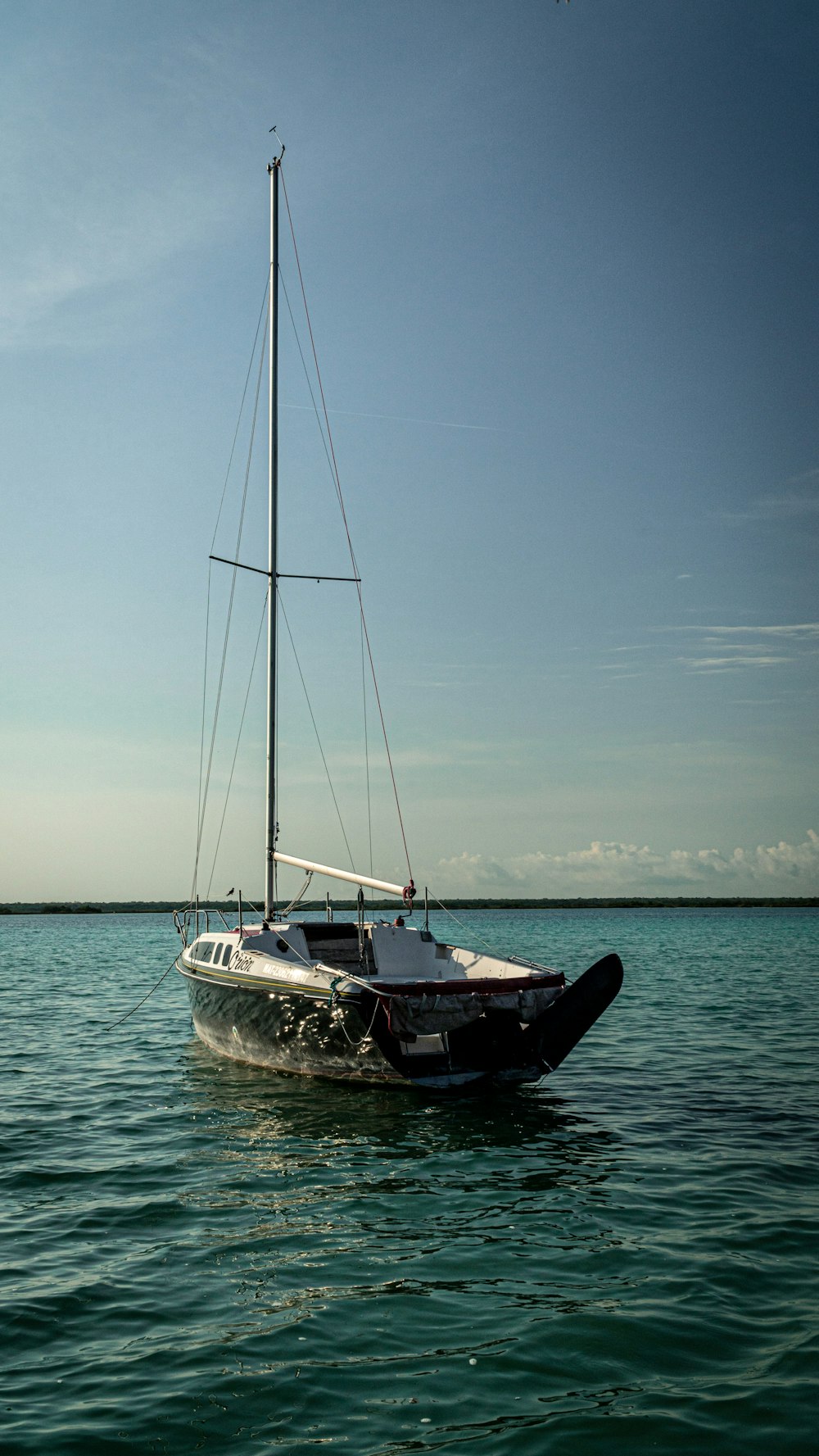 a sailboat in the middle of the ocean