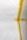 A white surface partially covered with strips of yellow masking tape arranged in an abstract pattern. There is a visible barcode on one piece of tape.