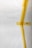 A white surface partially covered with strips of yellow masking tape arranged in an abstract pattern. There is a visible barcode on one piece of tape.