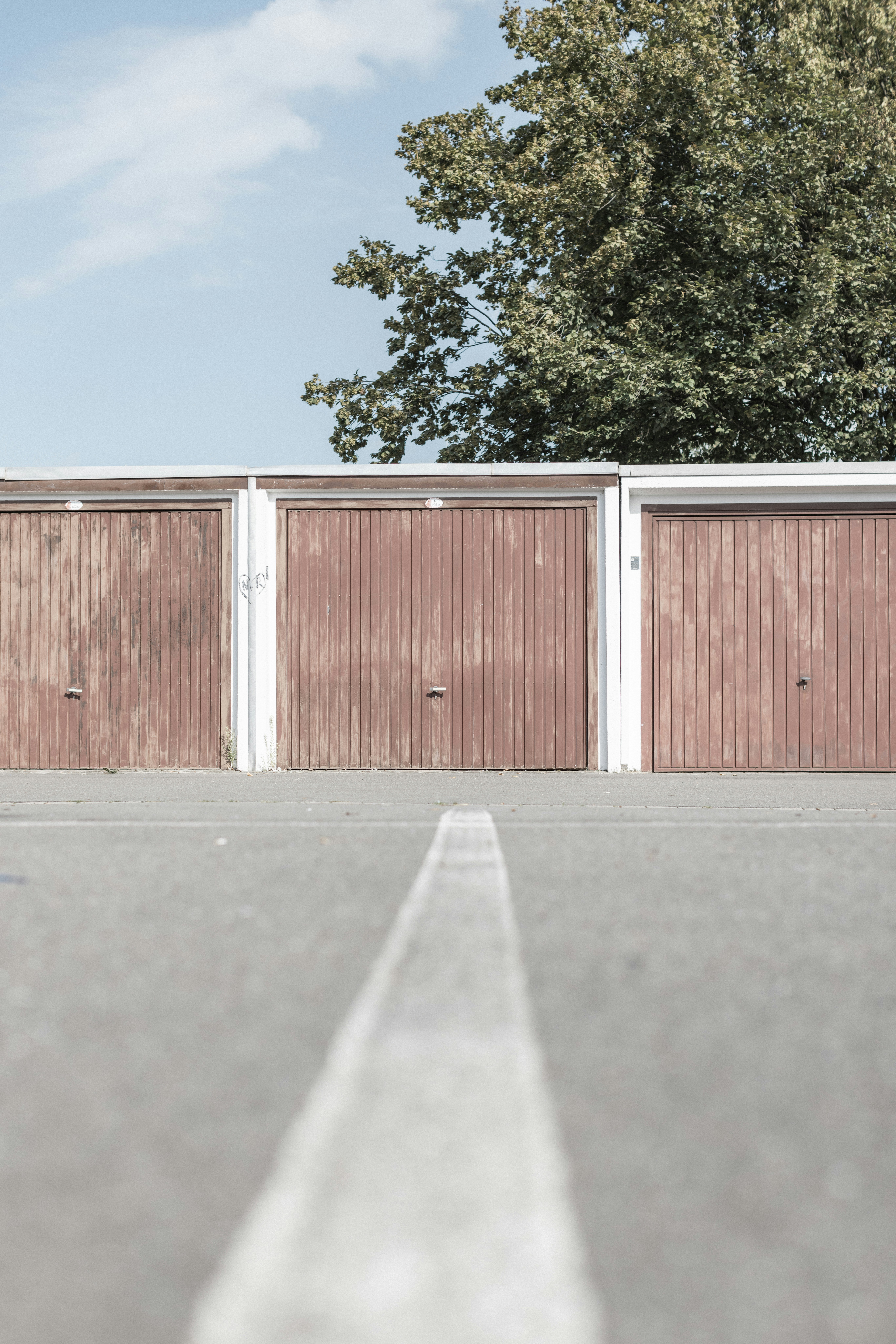 a man riding a skateboard down the middle of a parking lot