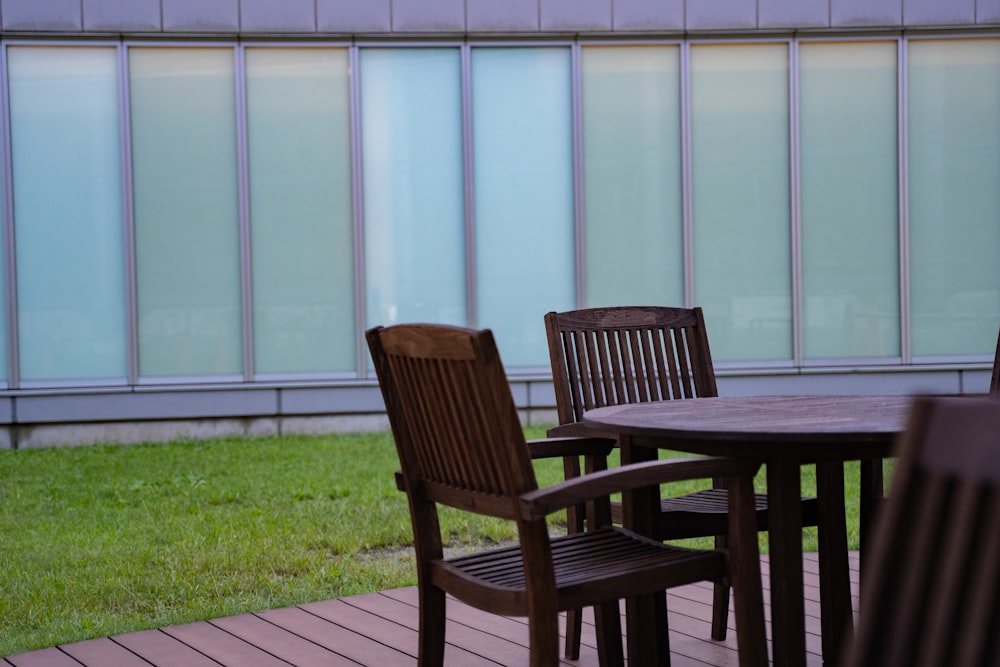 a table and chairs sitting on a wooden deck