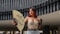 a woman with red hair is holding a fan