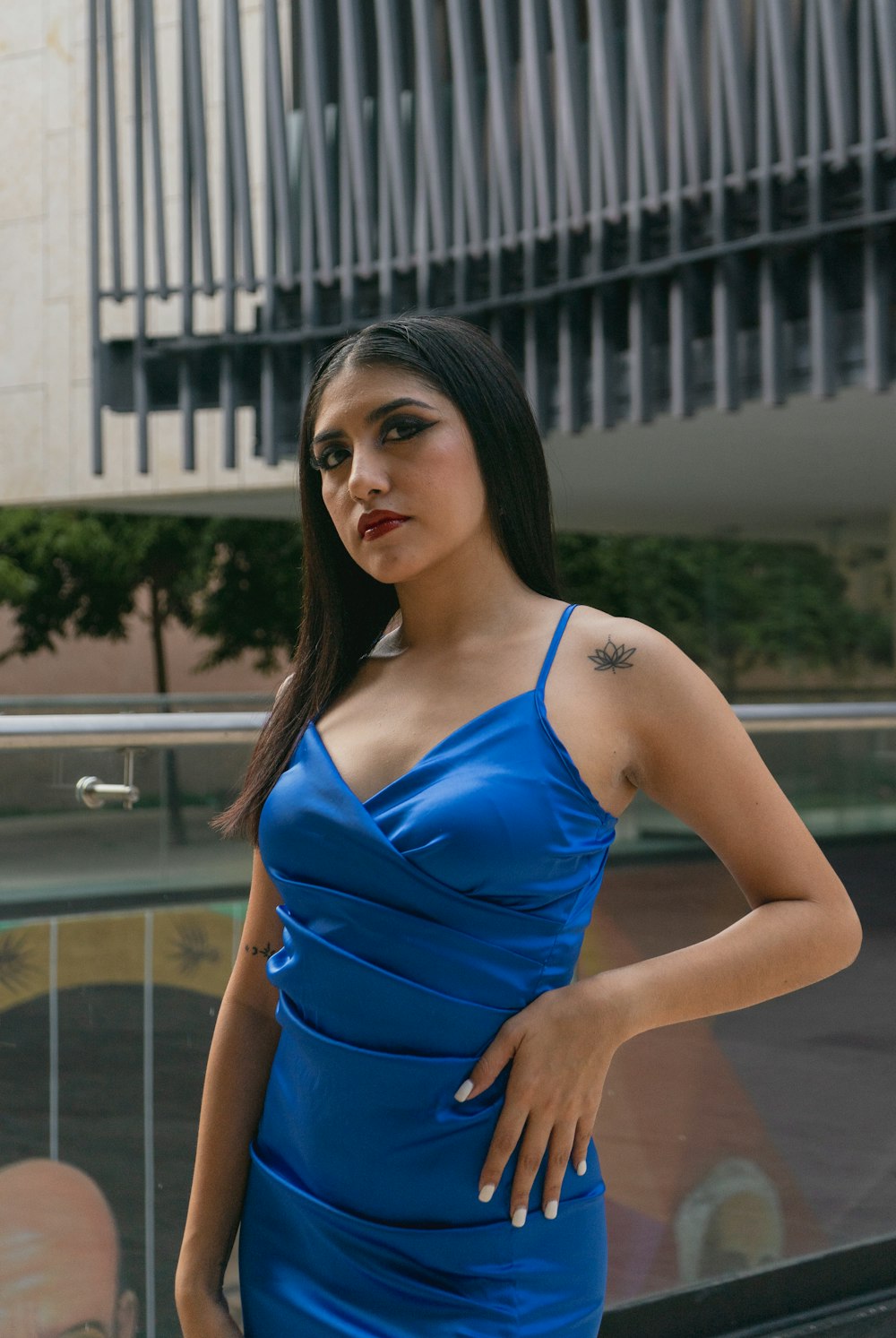 a woman in a blue dress posing for a picture