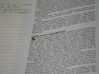 A close-up of a page from a book featuring text and margin notes. The text is printed in black on an off-white or beige page, with specific passages highlighted or bolded. Handwritten notes are visible in the margins to the left, and the overall layout includes paragraph indentation and line spacing typical of printed books.