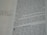 A close-up of a page from a book with printed text and handwritten notes in the margins. The text appears to be in English and consists of paragraphs, while the handwritten notes include a question.