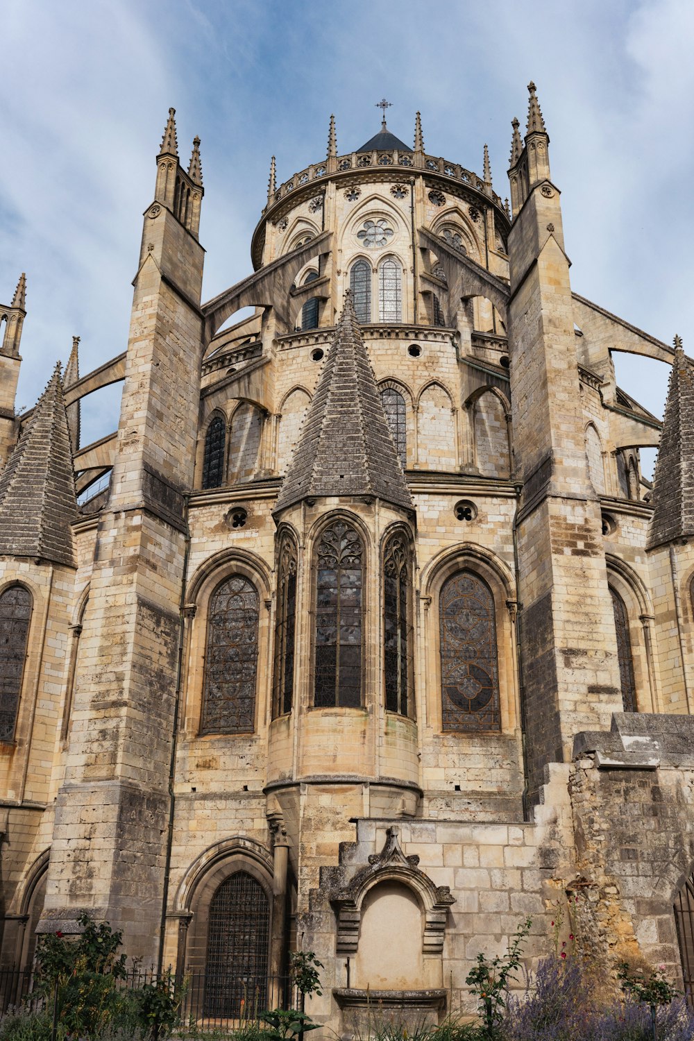 a large stone building with a clock on the front of it