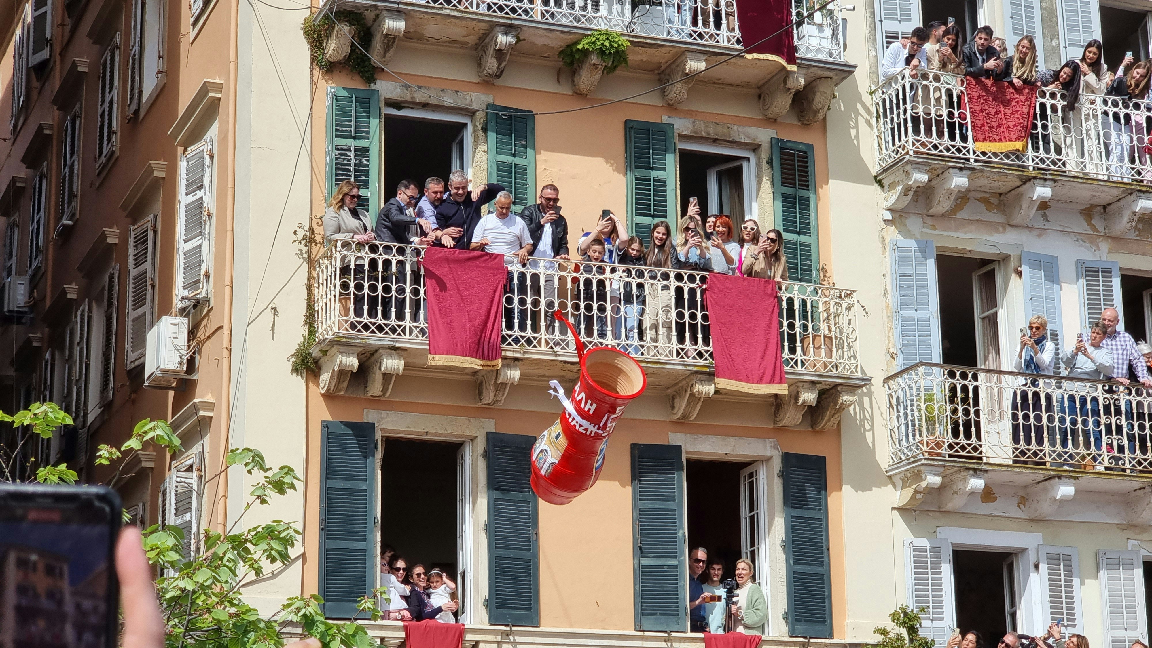 a crowd of people watching a show in front of a building