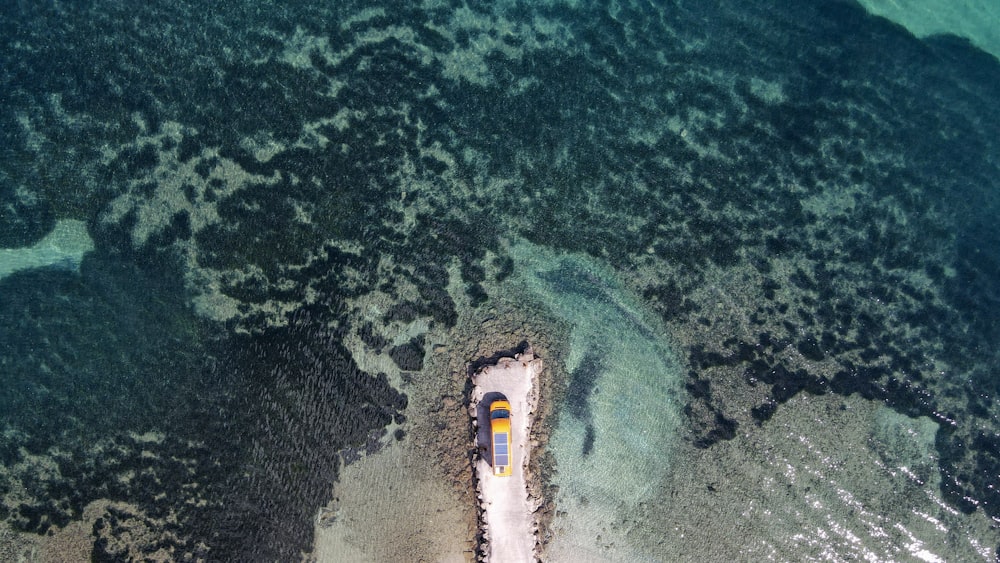 an aerial view of a boat in the water