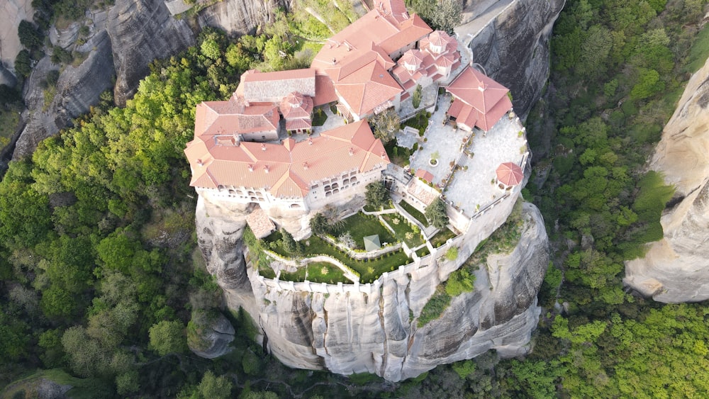 an aerial view of a castle on a cliff