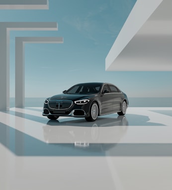 A luxurious office setting with a sleek car in the background.