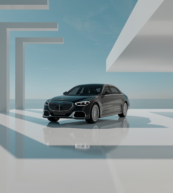 A sleek black luxury car is positioned in a modern, minimalistic architectural environment. The setting features geometric shapes and large, open spaces bathed in natural light. The sky is clear with subtle clouds, creating a serene backdrop. The car is prominently displayed, reflecting light off its polished surface.