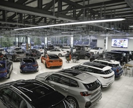 a bunch of cars are parked in a garage