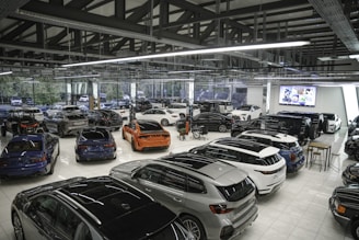 a bunch of cars are parked in a garage