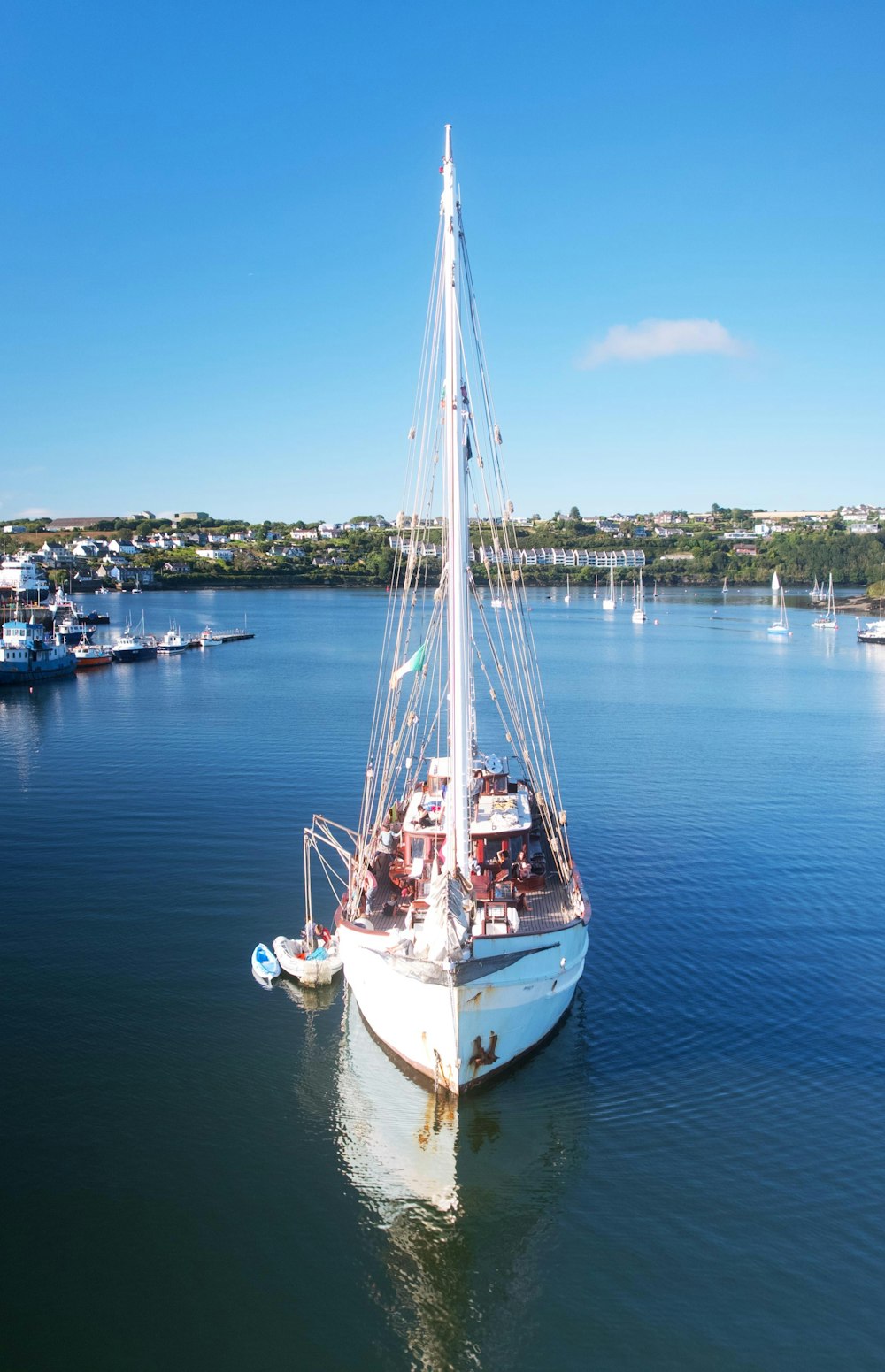 a sailboat in the middle of a body of water