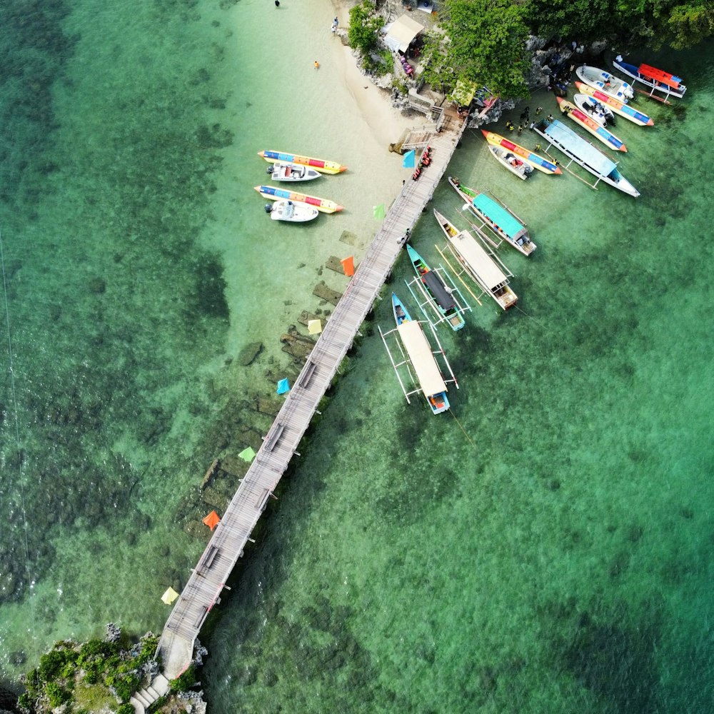 a dock with several boats in the water