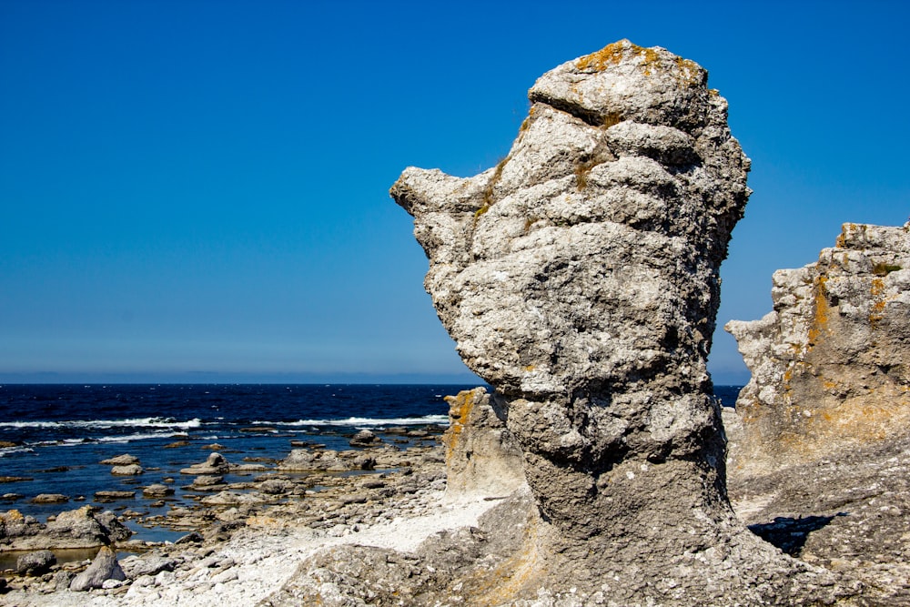 a rock formation in the middle of the ocean