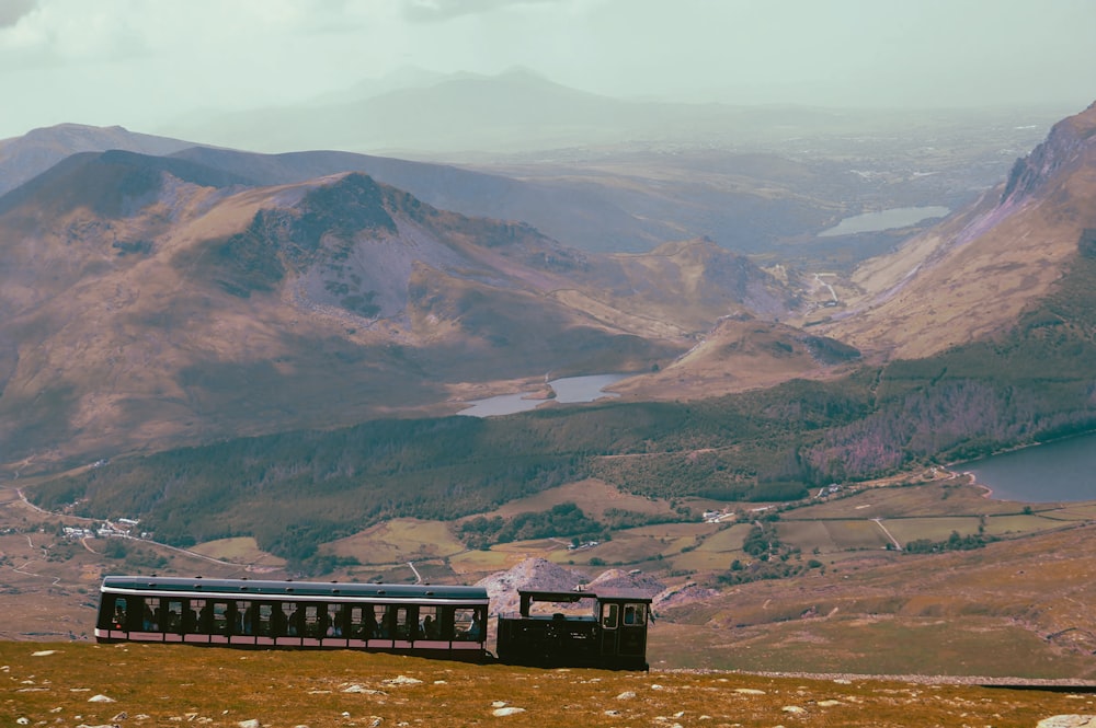 a train on a track in the mountains