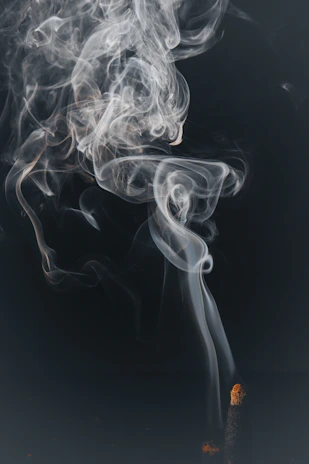 a cigarette with smoke coming out of it