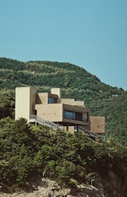 a building on a hill with a staircase leading up to it