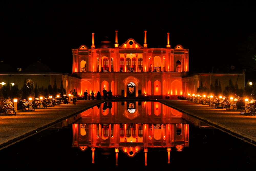 a reflection of a building in a pool of water