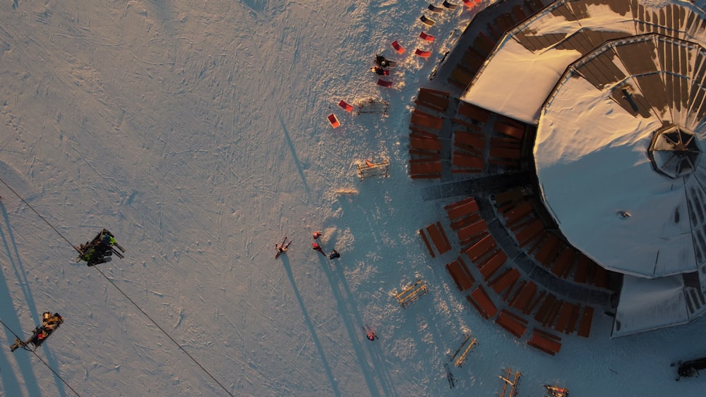 an aerial view of a building in the snow