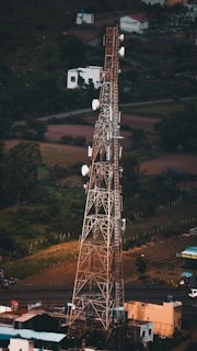 a tall tower with lots of antennas on top of it