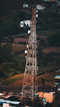 a tall tower with lots of antennas on top of it
