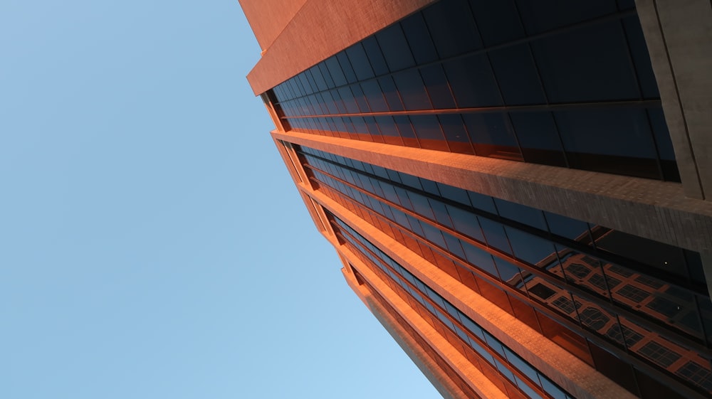 a tall building with a sky in the background