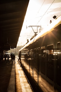 a train parked at a train station next to a platform