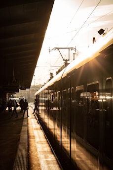 a train parked at a train station next to a platform