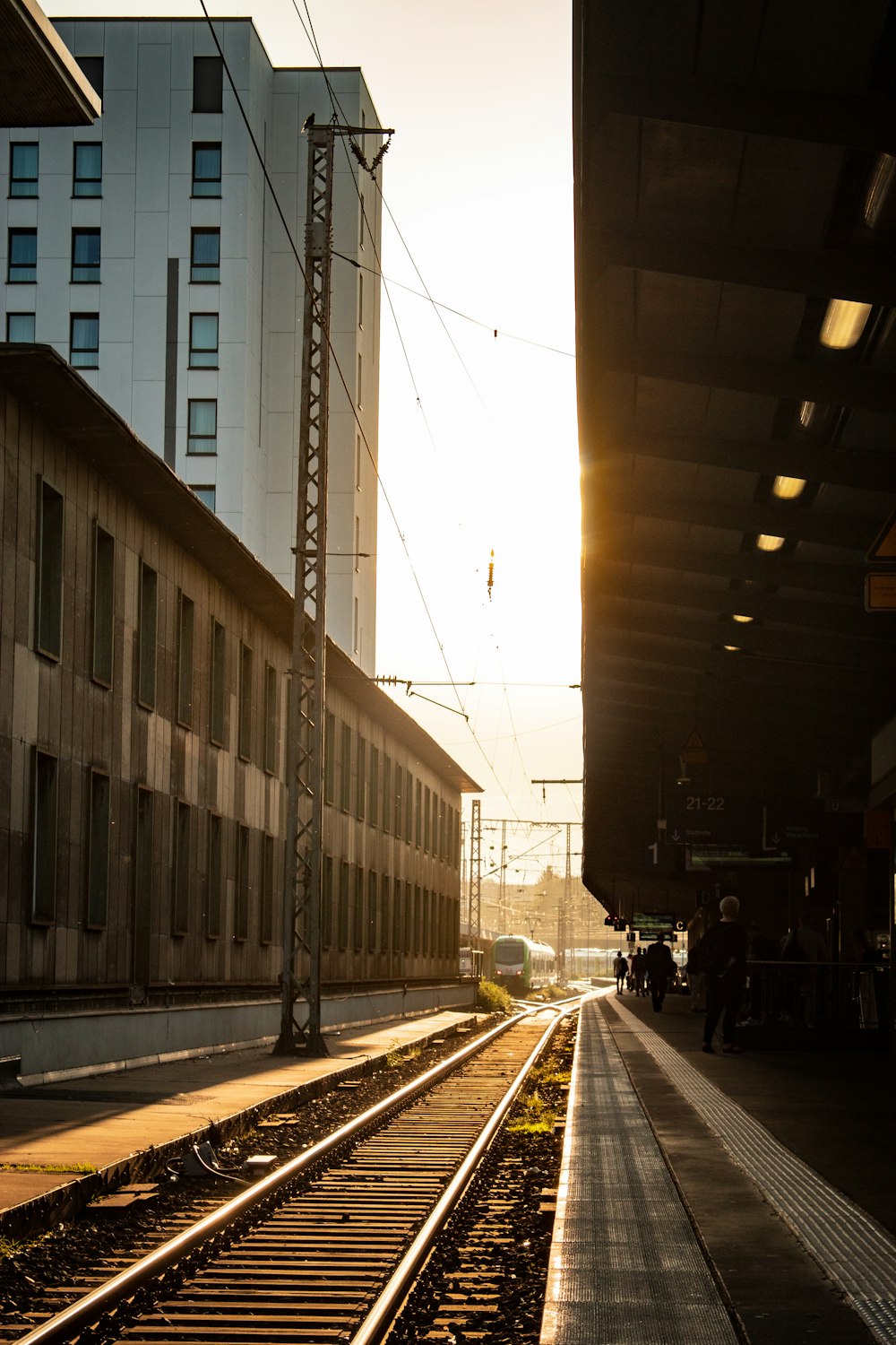 a train track with a building in the background