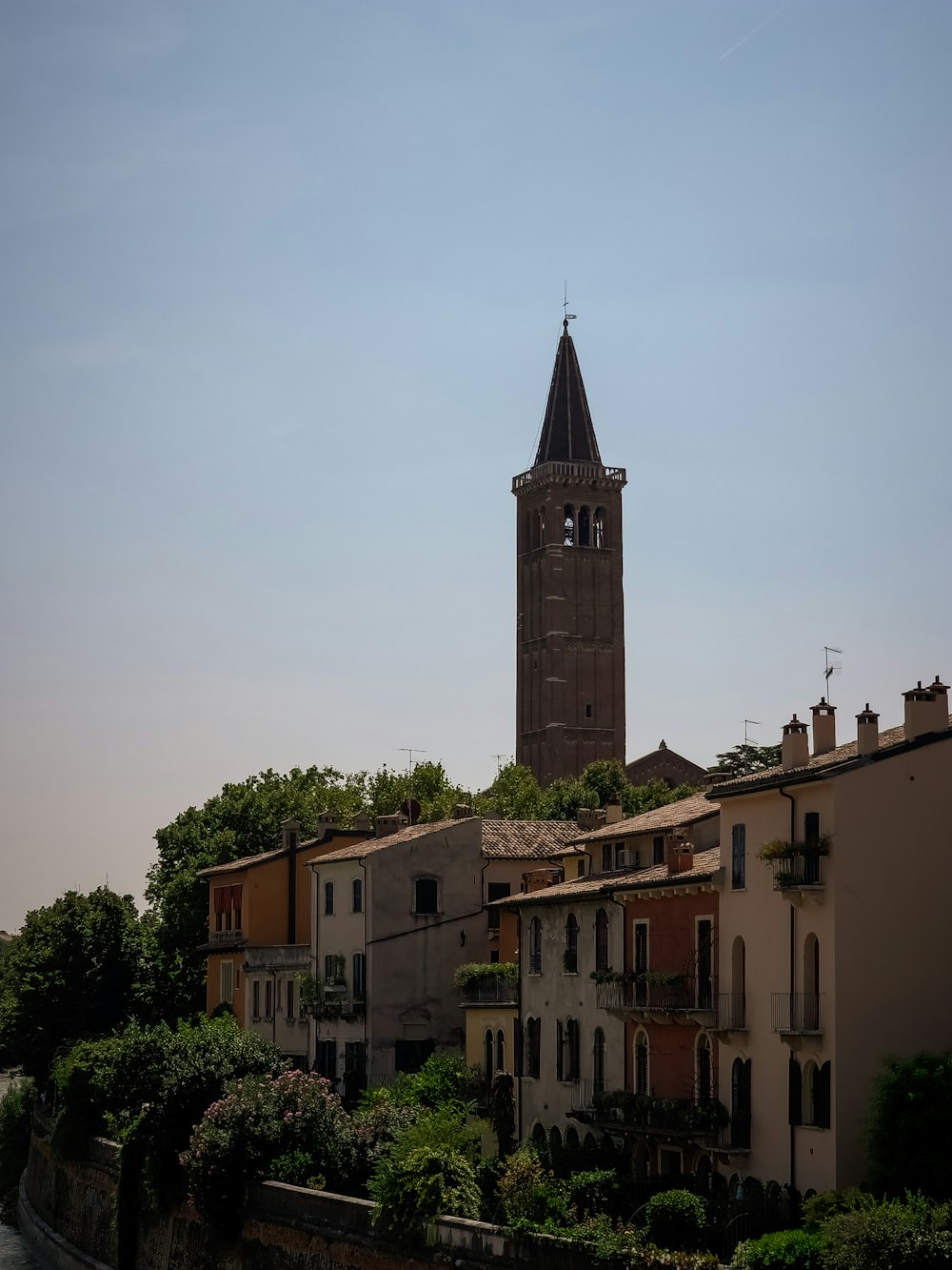 a tall clock tower towering over a city