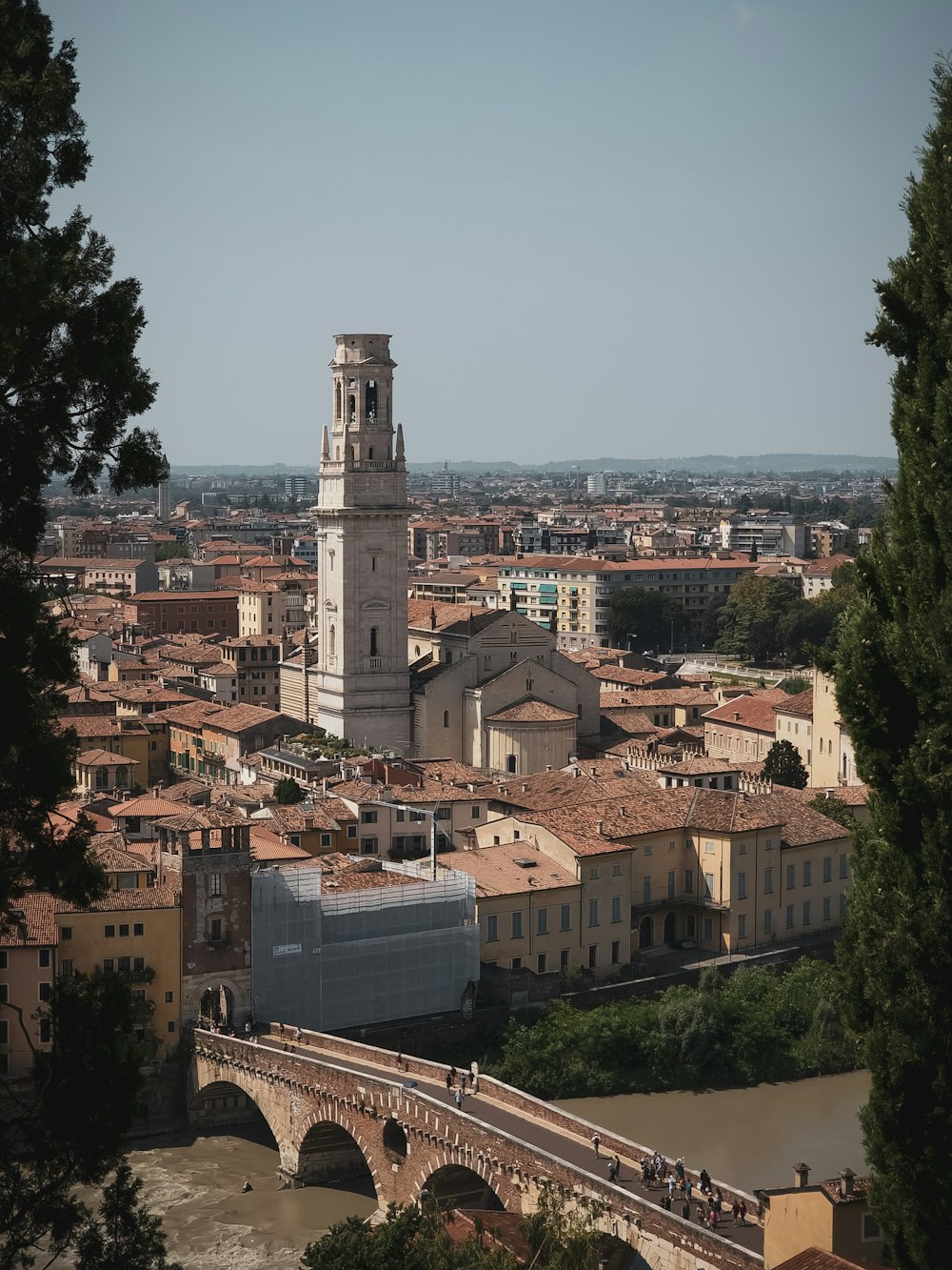 a view of a city with a bridge in the foreground