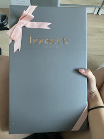 An open hamper showcasing premium treats and elegant branding for a corporate client.