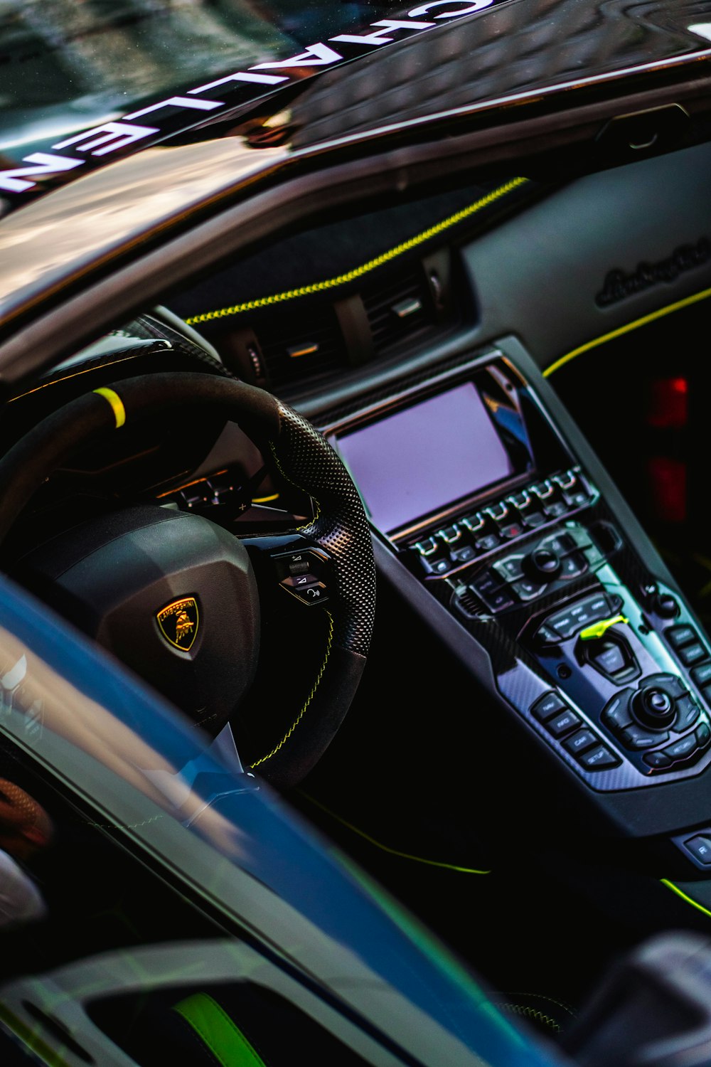 a close up of a car dashboard with a steering wheel