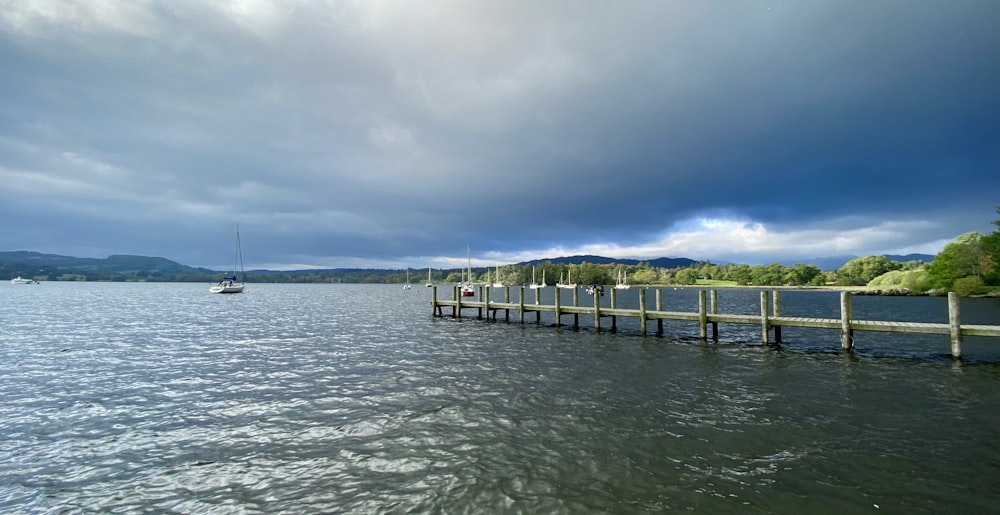 a boat is on the water near a dock