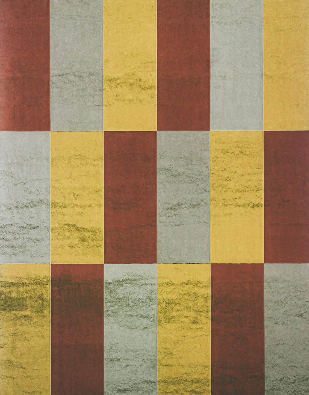 a multicolored rug with a checkered pattern