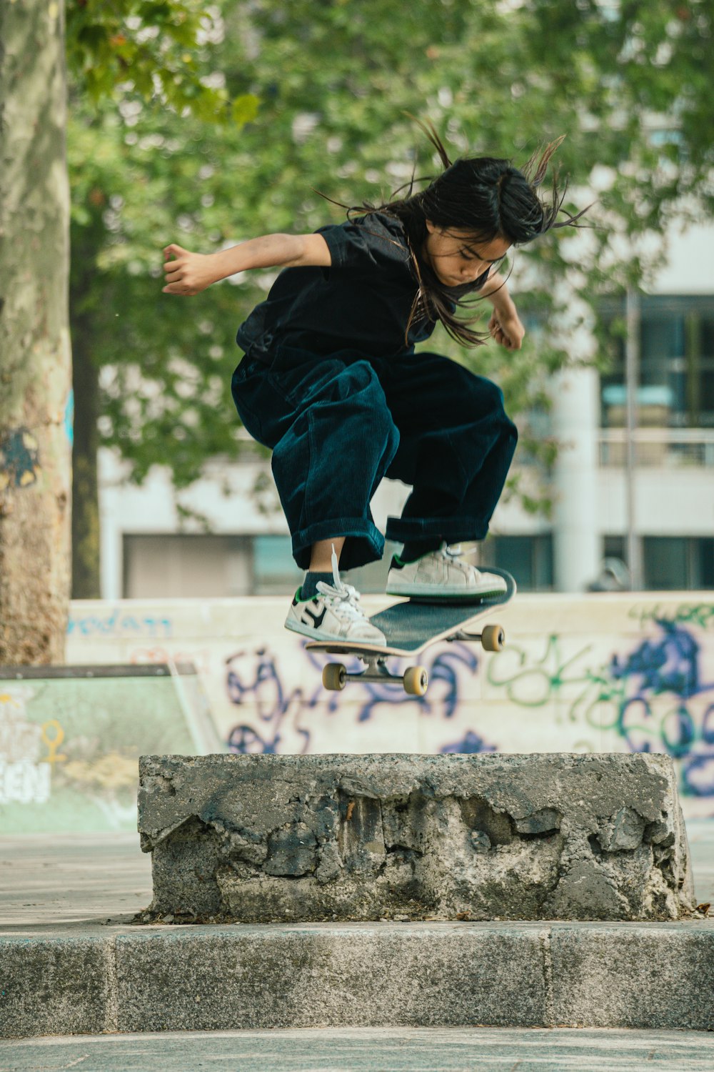 a man flying through the air while riding a skateboard
