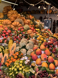 A colorful market stall displaying fresh tropical fruits from Colombia
