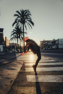a man is doing a trick on the street