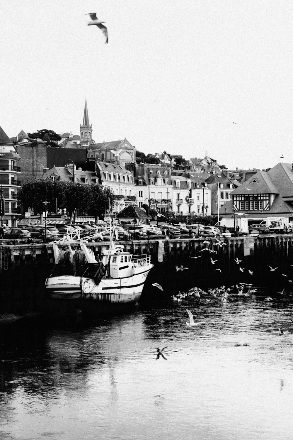 a black and white photo of a boat in the water