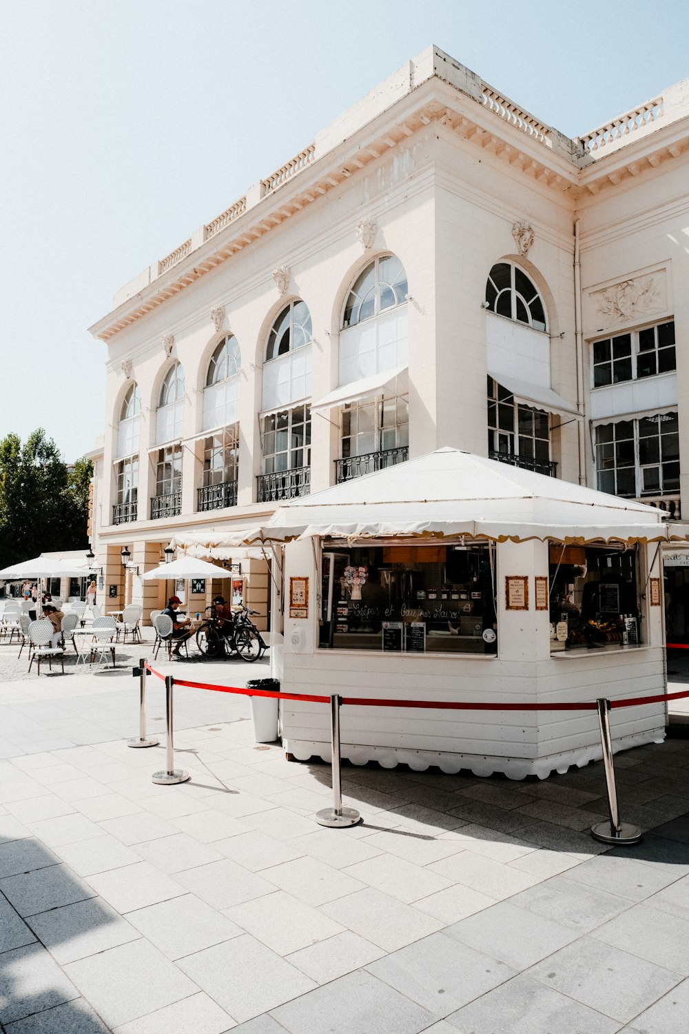 a large white building with a white awning in front of it