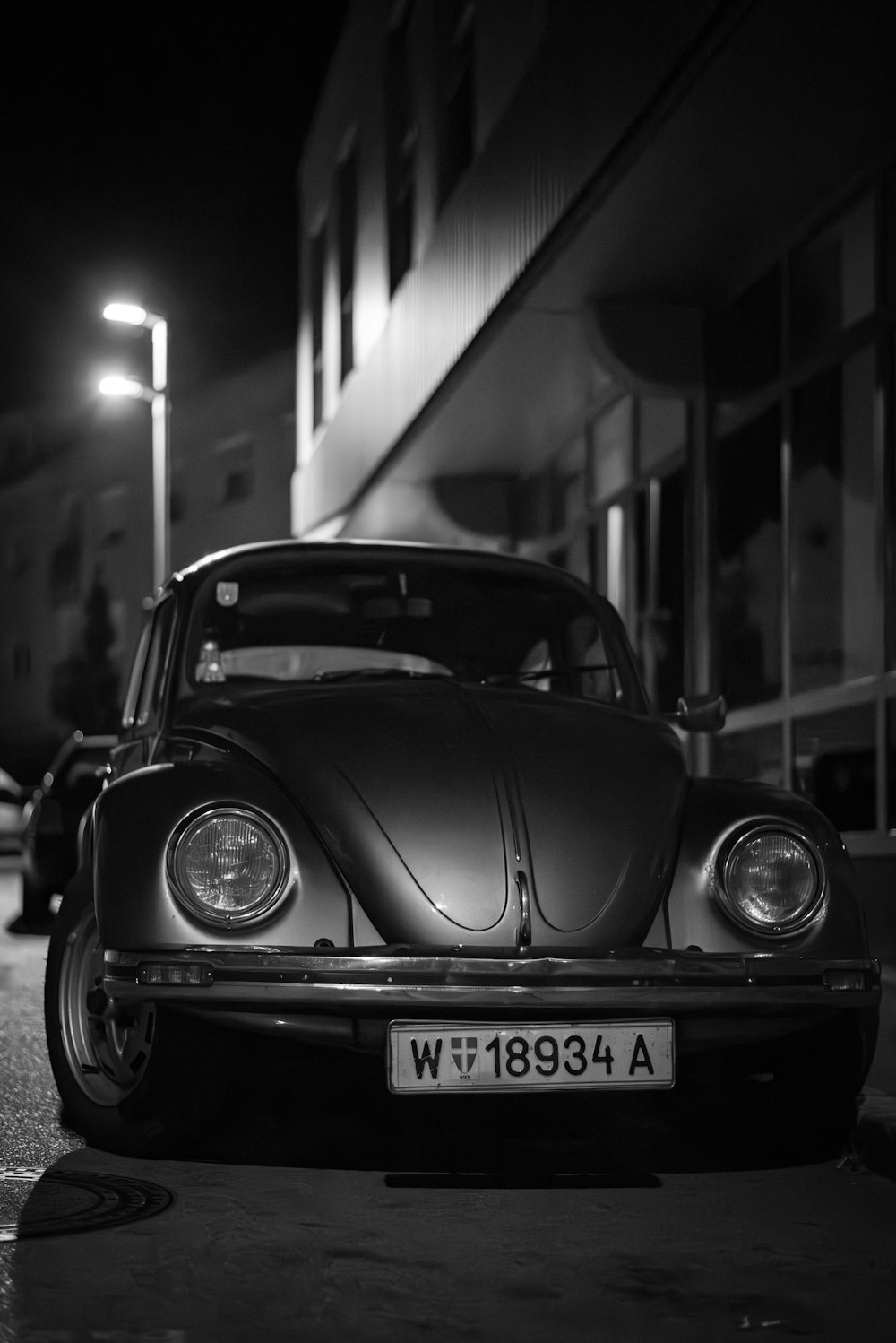 a black and white photo of a vw bug