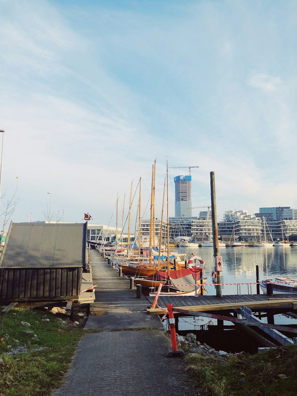 a dock with several boats in the water