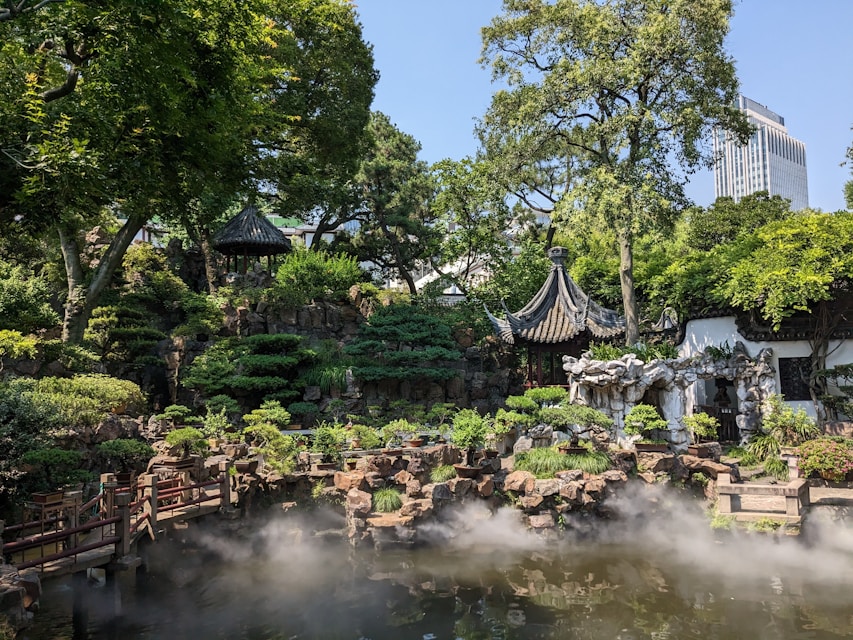 A serene zen garden with soft green sage tones and minimalist design elements reflecting inner peace.